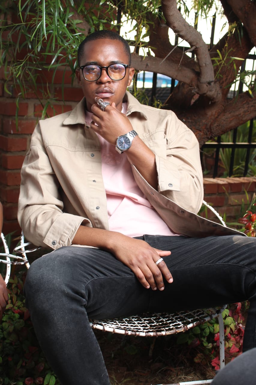 Dimpho sitting on a chair